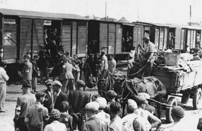 Lodz ghetto board trains for the death camp at Chelmno.jpg